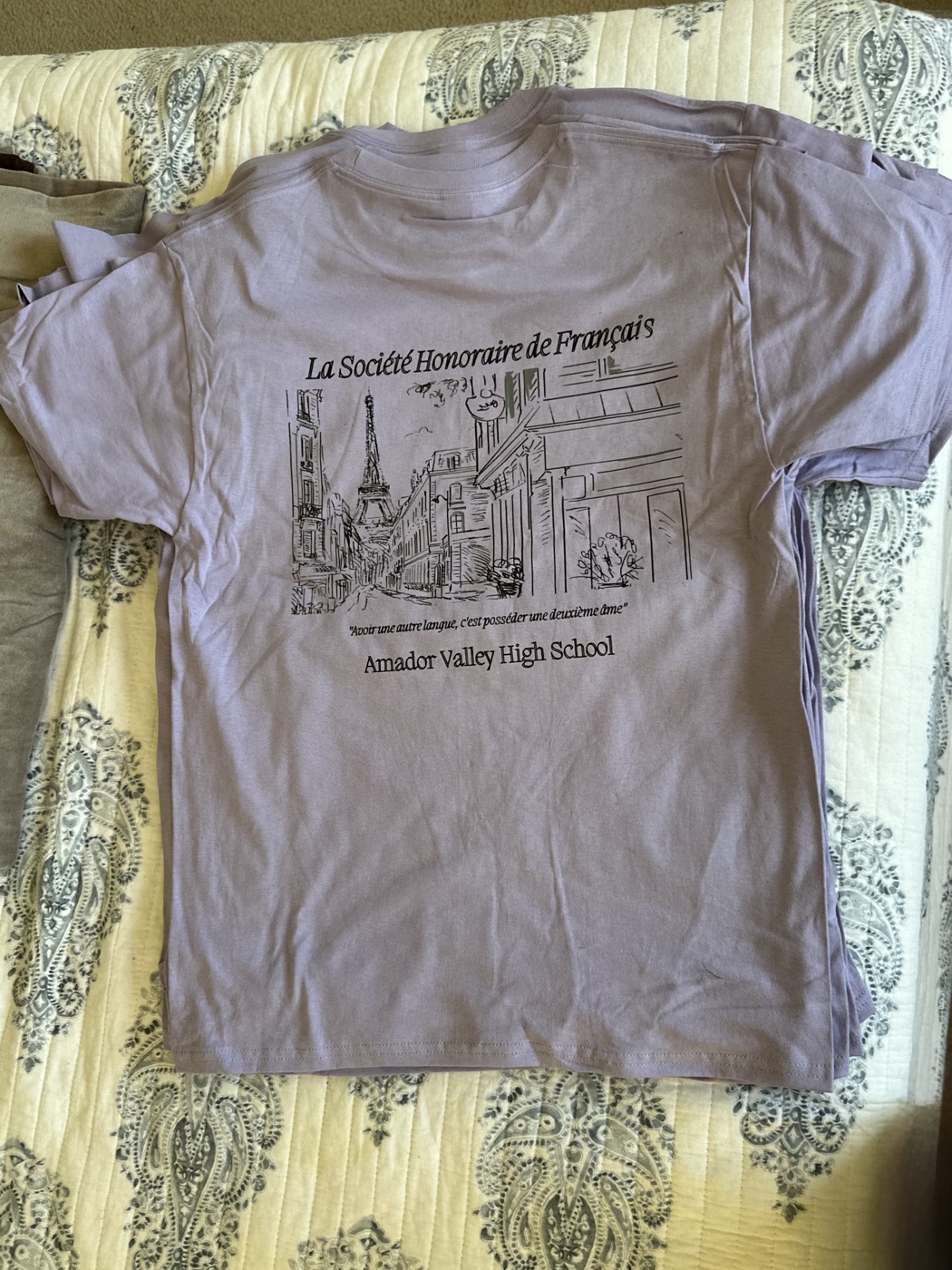 Lavender tee back print with a hand-drawn Paris street scene and the Eiffel Tower